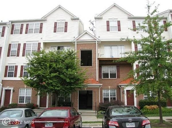 The unit entry is covered and on the third floor. This is a