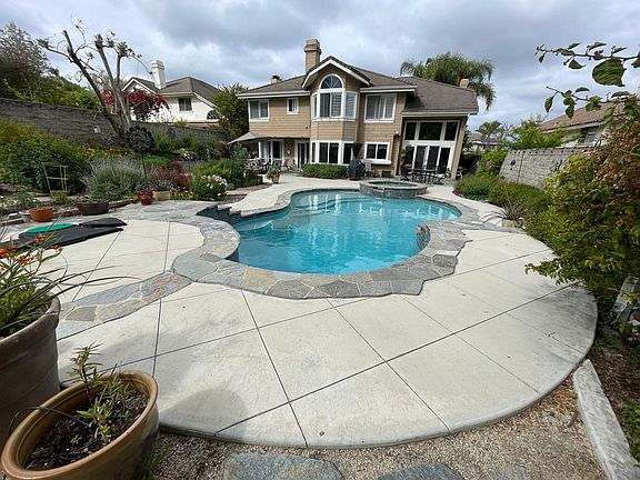 Backyard pool that is maintained weekly by a pool service paid by owners