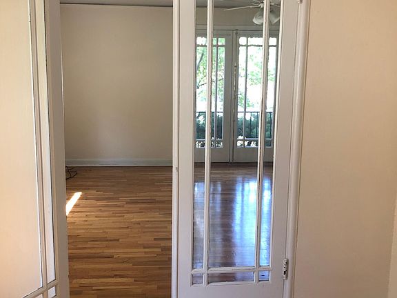 Double French doors from bedroom into living room