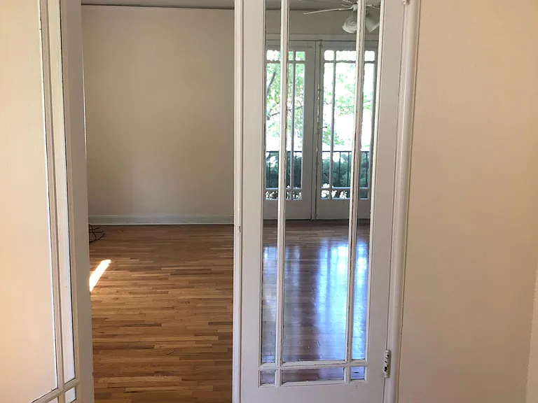 Double French doors from bedroom into living room