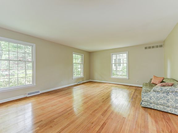 Large living rm has exposed hardwds & fresh paint