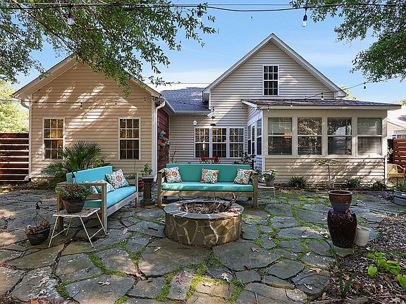 Shady backyard with firepit