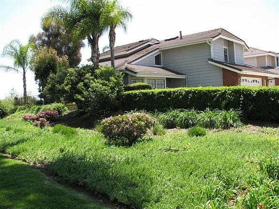 View of home from greenbelt - no homes located to the left of this property.