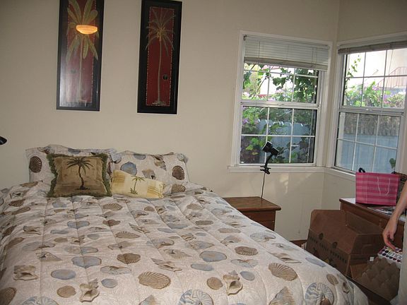 Bedroom with Oak Flooring and Windows