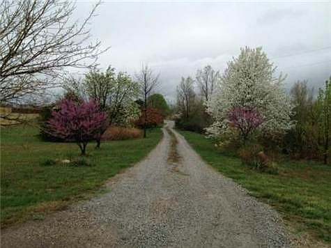 Home sits back from road. Lovely tree lined driveway!!