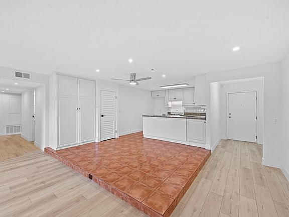 Middle of great room into kitchen and hallway to common area.