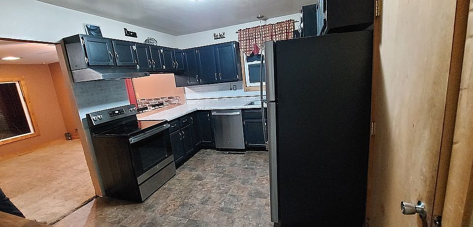 1st image of 102 E 1st St