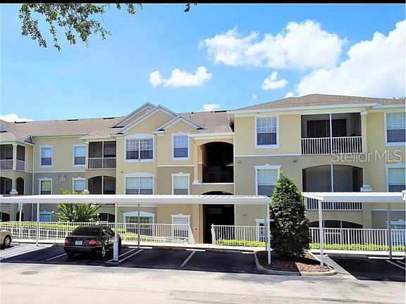 Building exterior with covered assigned parking to protect your vehicle from the hot Florida sun