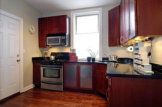 Stainless Steel, Granite & Dark Wood Kitchen