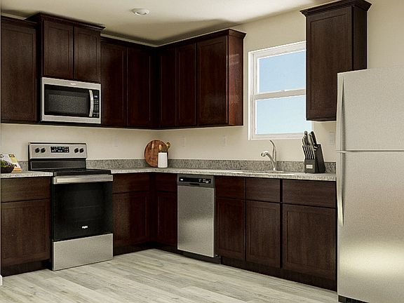 Enjoy this chef-ready kitchen with a full suite of appliances, granite counters and