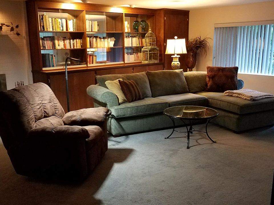 Spacious LR with library with comfy recliner for TV