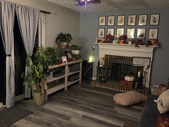 Family room with fireplace and slider door to deck.