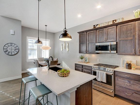 Gourmet Kitchen with Stainless Appliances, Gas Range, Dishwasher, Refrigerator, Quartz Countertops, and Pantry