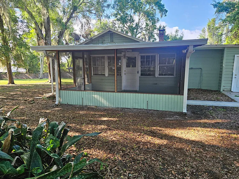 Screened back porch with outside small storage area
