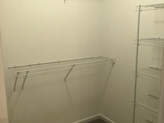 Primary Bedroom walk-in closet