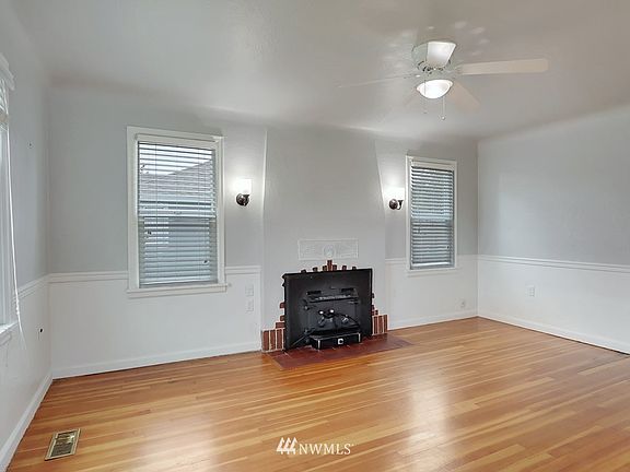 Light and bright living room with cozy wood burning stove,