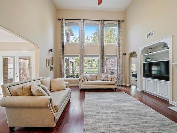 Located towards the back of the home is the Spacious Den with captivating windows soaking in the panoramic golf course views.