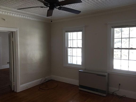 Living/dining room, looking back through door into bedroom.