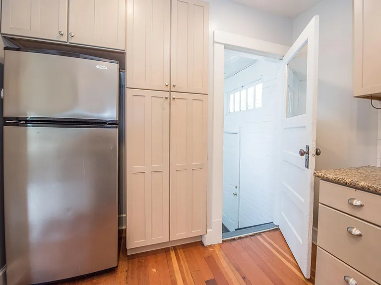 pantry, stairs to lower level and backyard