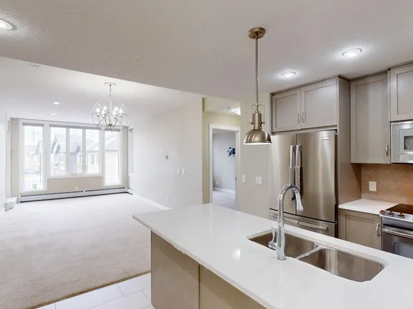 39 Quarry Gate SE #206, Calgary, AB T2C 5P4
