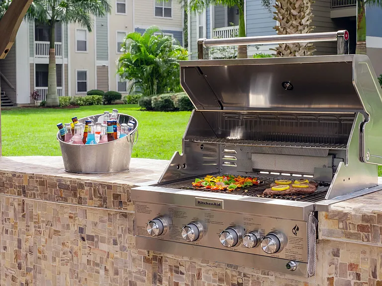 Host cookouts and show off your grilling finesse at the fully equipped outdoor kitchen.