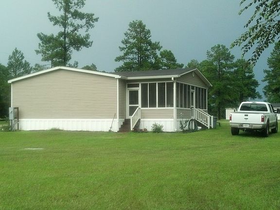 NICE PORCH : 12X25 WITH GABLE ROOF, HAS TWO CEILING FANS