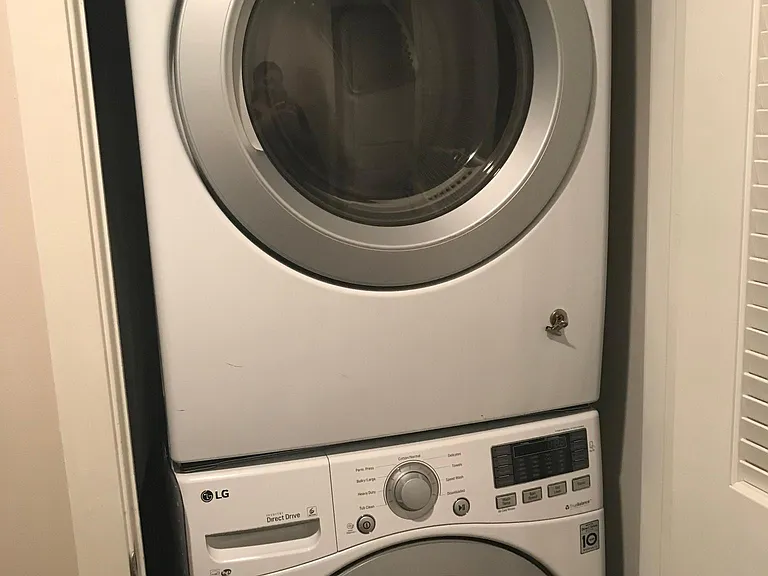 Full-sized washer and dryer in unit.