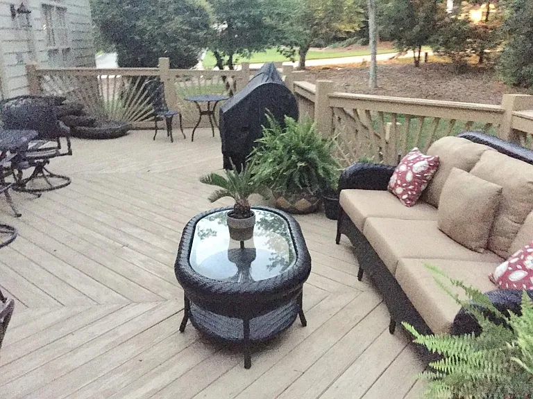 Deck with fountain, and sofa.