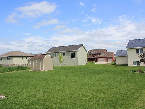 Spacious back yard with storage shed