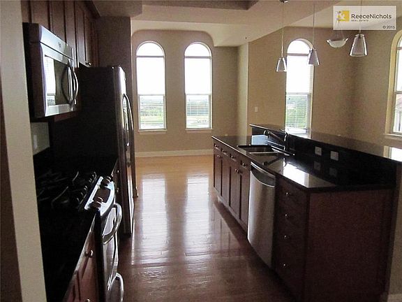 Kitchen looking towards dining room and west windows.