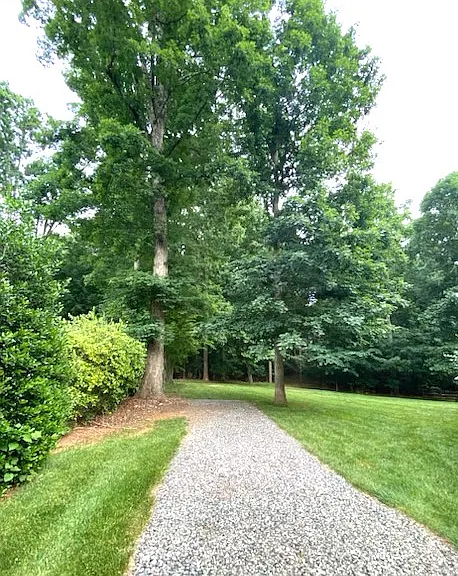 Extended driveway on side of house, for additional parking, boat, jet skis, etc.