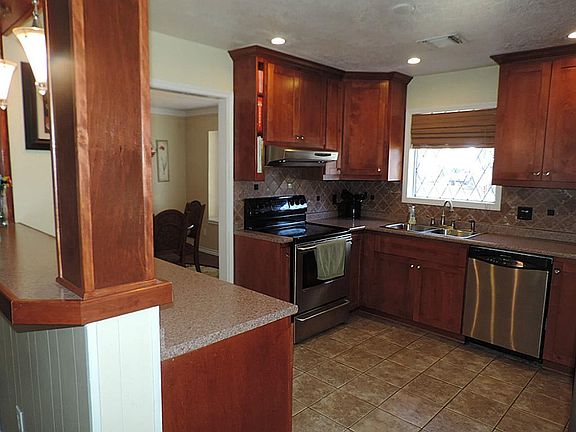 Recently remodeled Kitchen with Custom cabinets*Tiled floors*Stainless Appliances + Open to the Den!