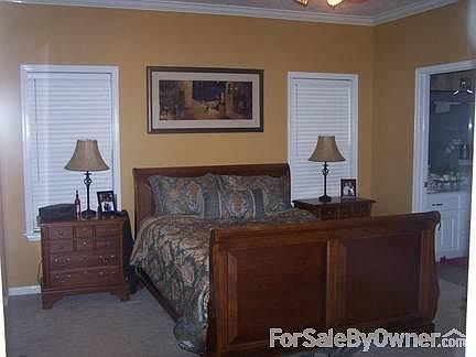 Kitchen and breakfast room with large windows.