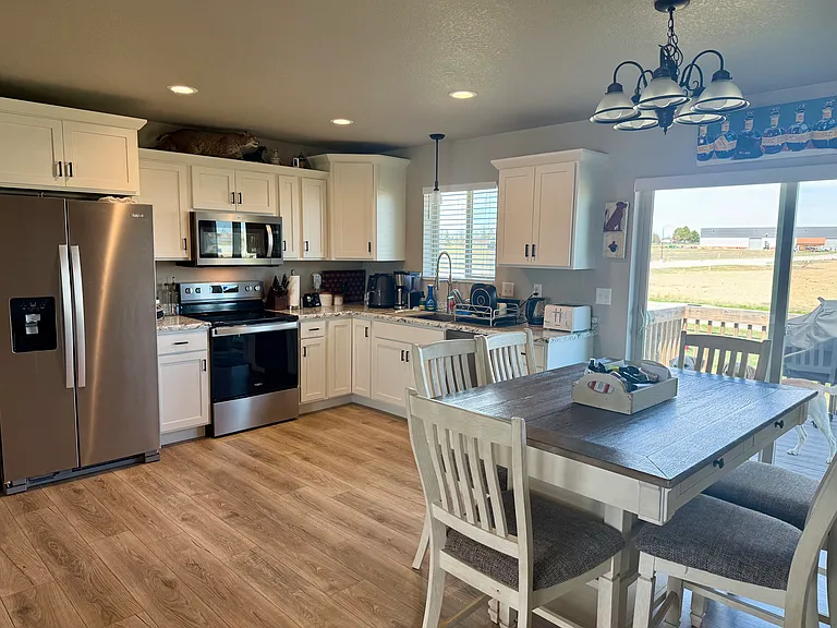 Kitchen - dinning room with deck & backyard access