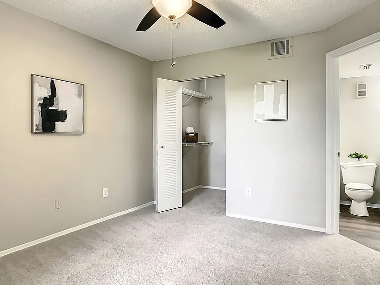 Delight your roommate or family member the gift of their own walk-in closet and ensuite bathroom in this guest bedroom ensemble.