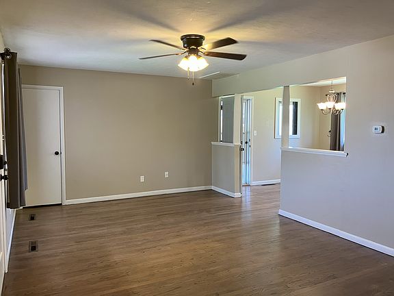 Living room with hard wood floors.