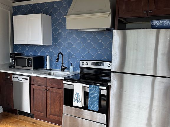 Clean, fully stocked kitchen.