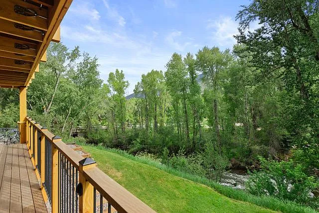 Balcony overlooks the river.
