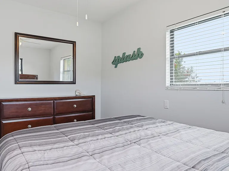 Bedroom #2 has queen bed plus 6 ft of closet space and good natural lighting.