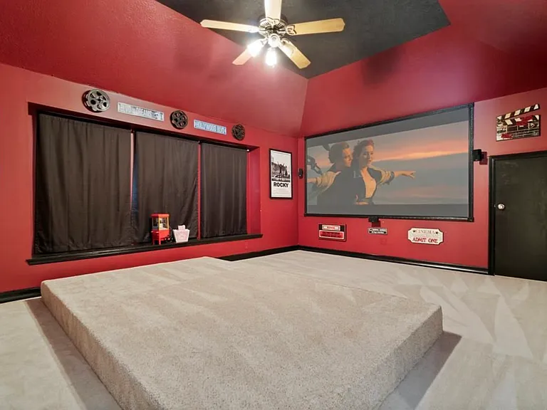 Home theater has a 130 inch projector. Built in BOSE surround sound system. Apple TV device. Elevated platform. Blackout window curtains for a better movie watching experience.
