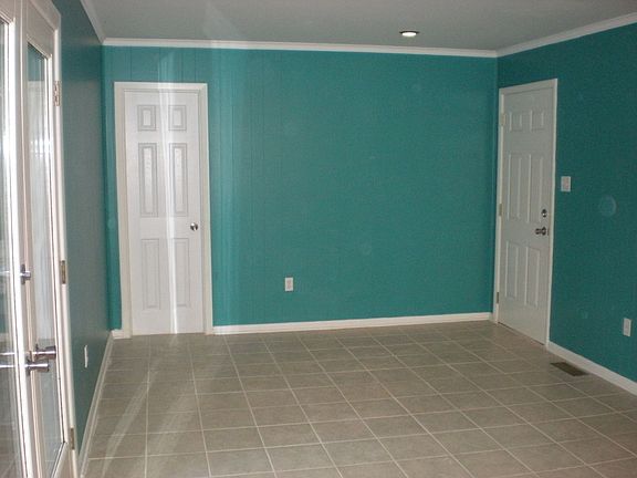 Dining area with door leading to laundry room