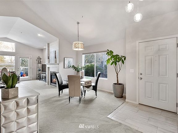 Step into the tiled entry, noting the newer carpet and interior paint throughout. 