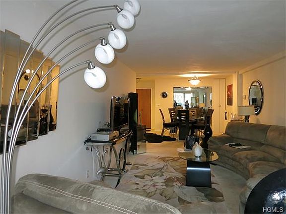 Living Room/Dining Room with parquet floors under carpeting