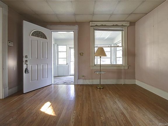 New entry door welcomes you into sunfilled living room!