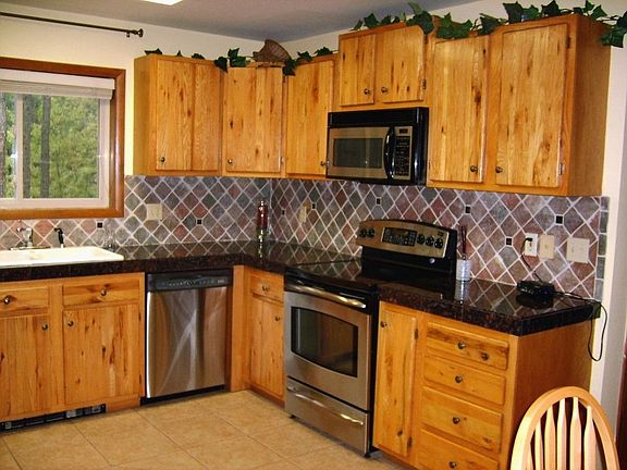 Refurbished kitchen with stainless steel appliances