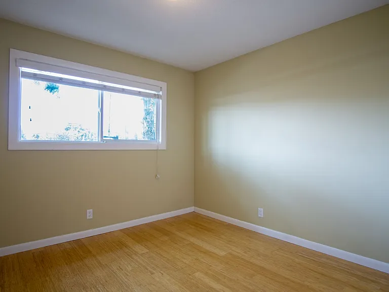 Get 1 Month FREE! Top-Floor 2-Bedroom with Bamboo Flooring + Off-Street Parking! — Photo 14