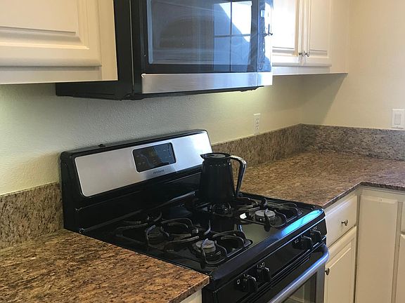 Kitchen view 2 granite countertops.