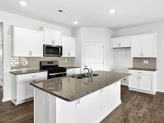 Open concept kitchen with walk-in pantry :) Home comes with deluxe fridge.