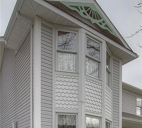 Beautiful Gingerbread and so much natural light from two bay windows.