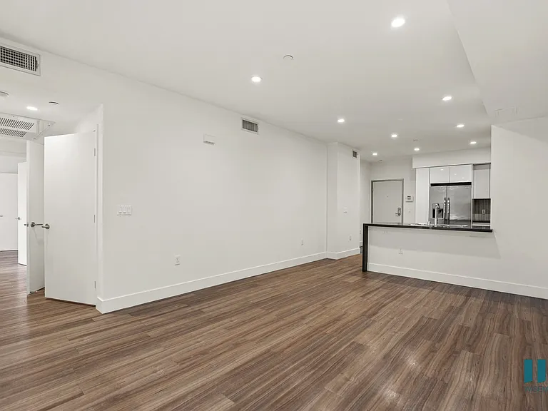 Front Entrance of Unit, Kitchen and Dining Space